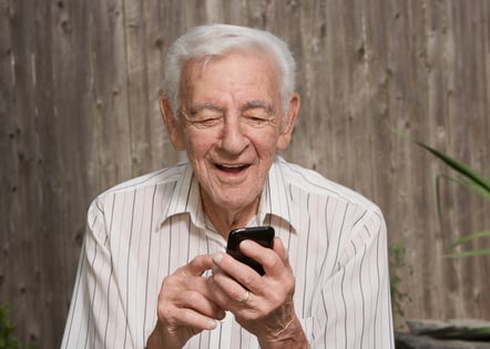 older man using mobile phone